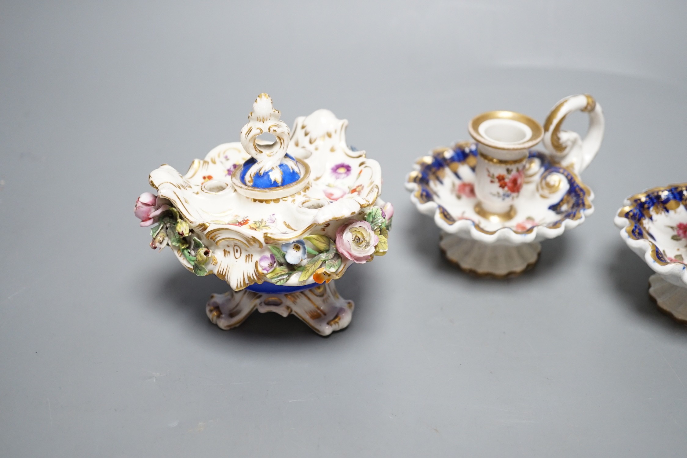A Coalport floral encrusted inkwell cover and liner, marked C-Dale in blue and two English porcelain tapersticks painted with roses perhaps Coalport, c.1820